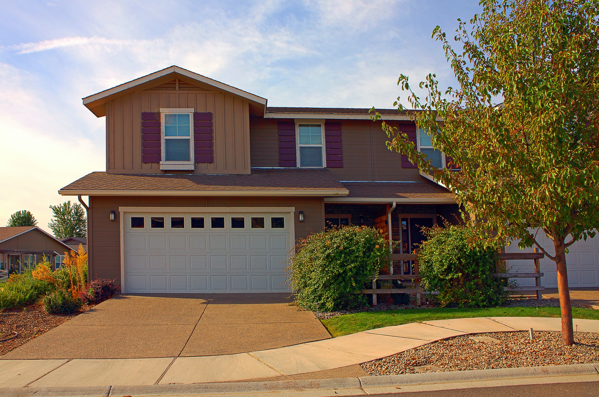 House and driveway in suburban neighborhood