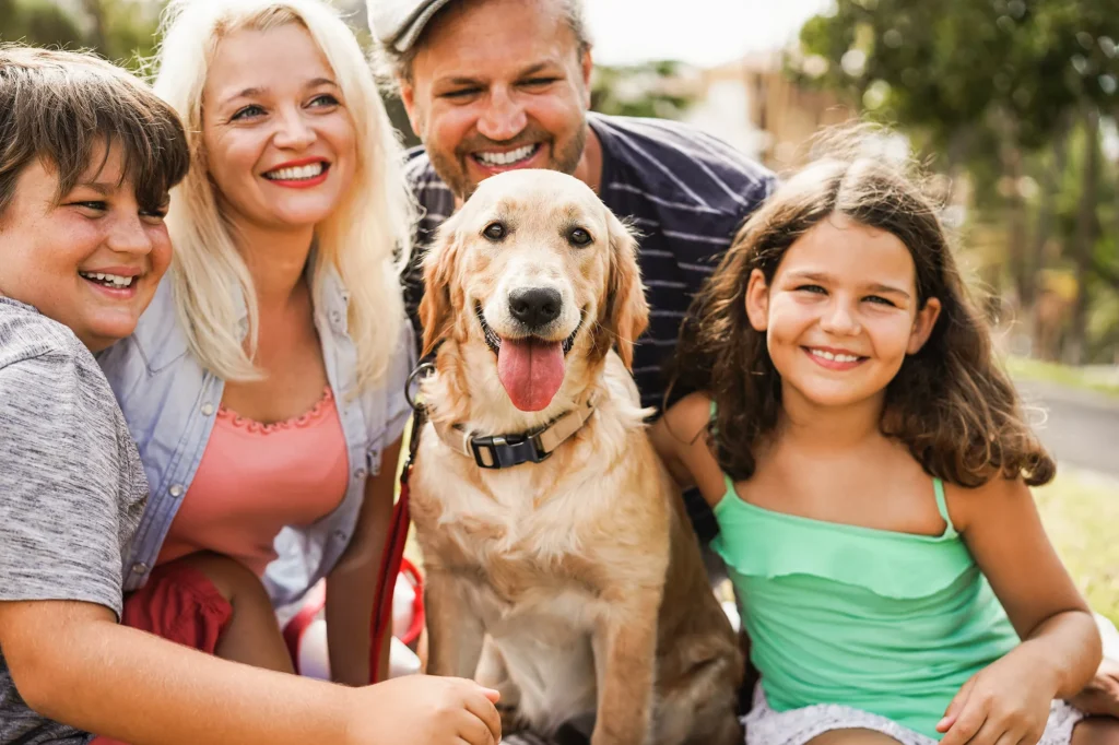 happy-family-having-fun-with-children-and-their-dog