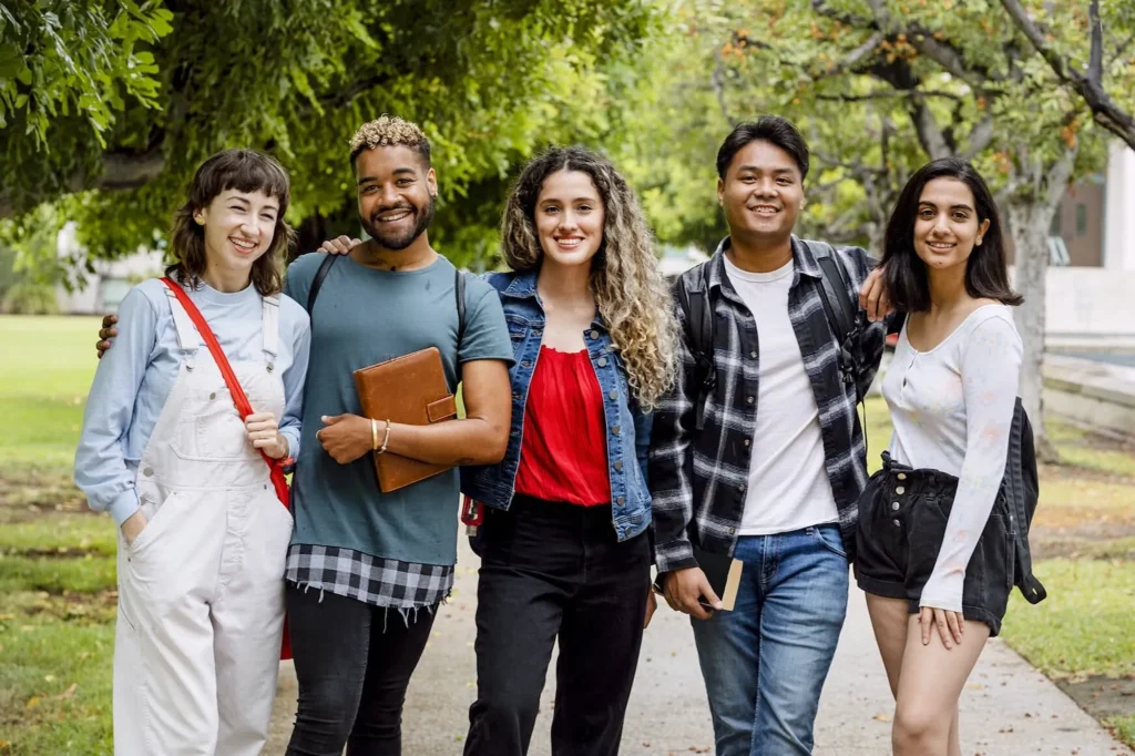 Diverse university students at campus in summertime