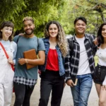 Diverse university students at campus in summertime